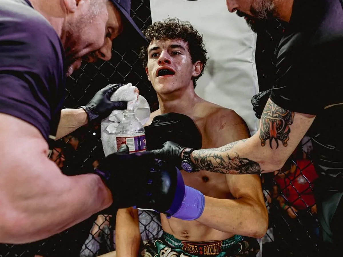 Coaches working a fighter's corner between rounds at a cage event